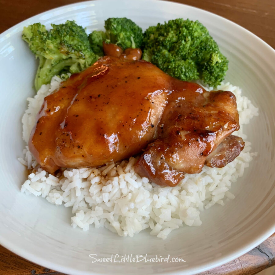 This image shows the chicken served over white rice with broccoli. 