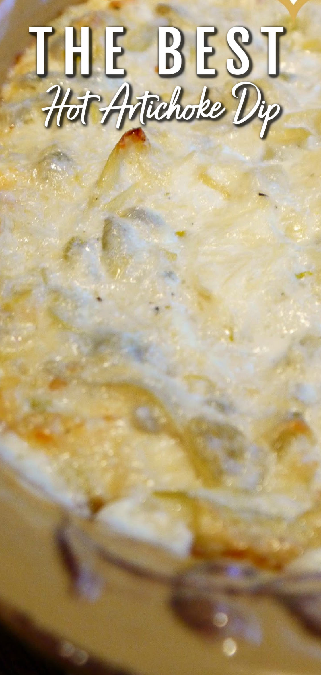 This image shows a close up of hot artichoke dip in a baking dish. 