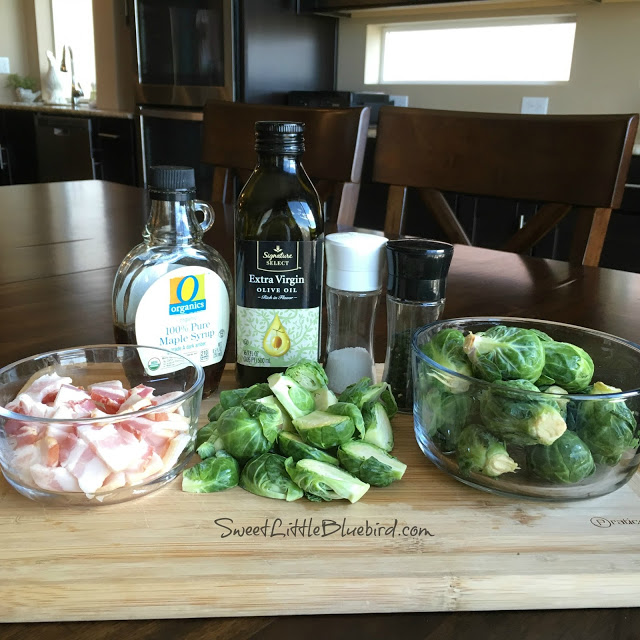 This is a photo of all the ingredients on a cutting board needed to make the Brussels sprouts. 