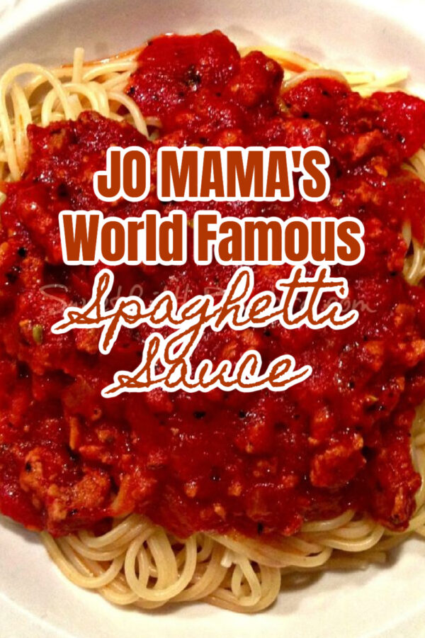 Photo of Jo Mama's Spaghetti Sauce served over spaghetti in a white bowl. 