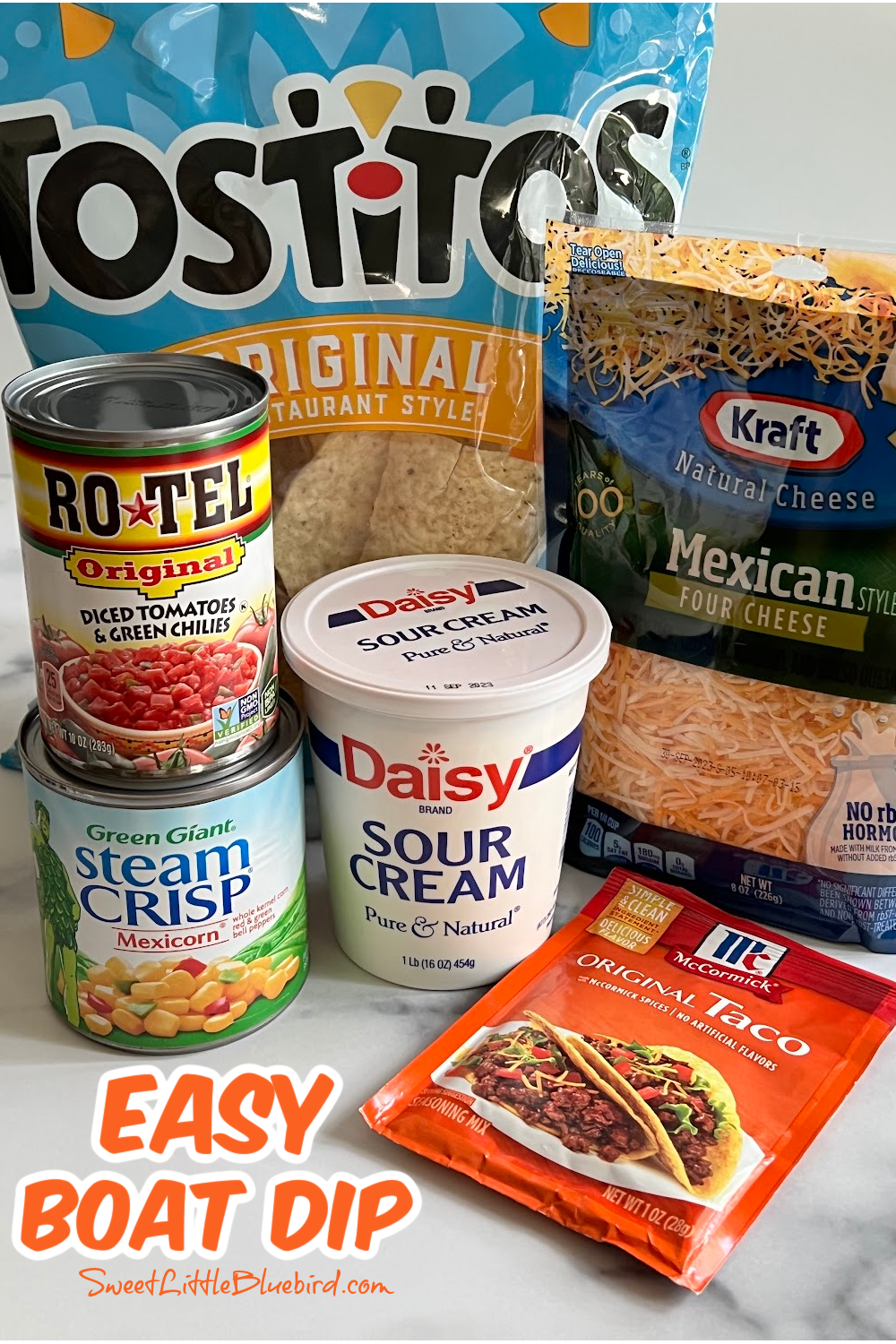 This photo shows all the ingredients needed to make boat dip. Sour cream, Mexican-Style four cheese blend, taco seasoning, Mexicorn and Rotel. 