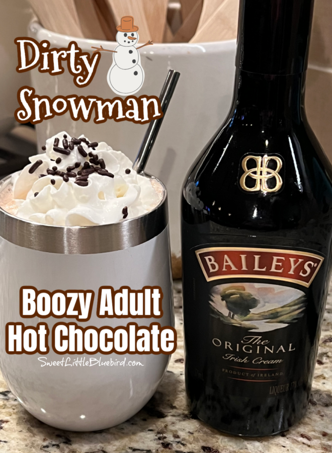This photo shows the Dirty Snowman cocktail served in a short white wine tumbler next to a bottle of Baileys.
