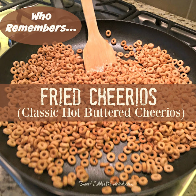 This is a photo of Hot Buttered Cheerios cooking in a large skillet with a wooden spoon.