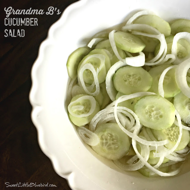 This is a photo showing cucumber salad in a white bowl.