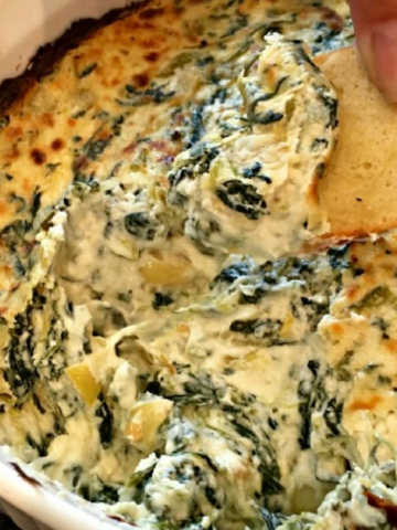 This photo shows a spinach artichoke dip after baking.