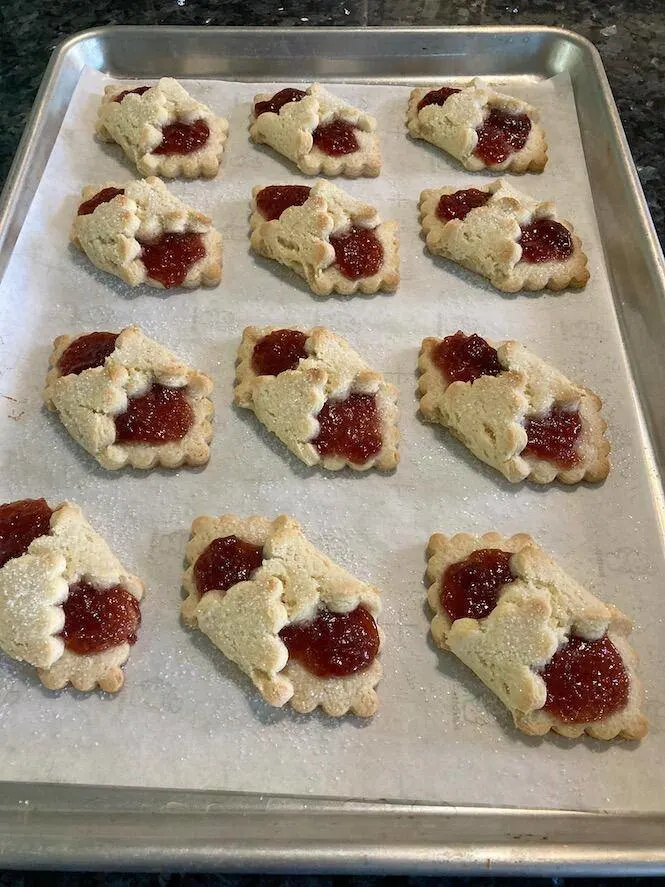 Photo of baked Cake Mix Kolaches on parchment paper on a cookie sheet - by Out Of The Box Baking