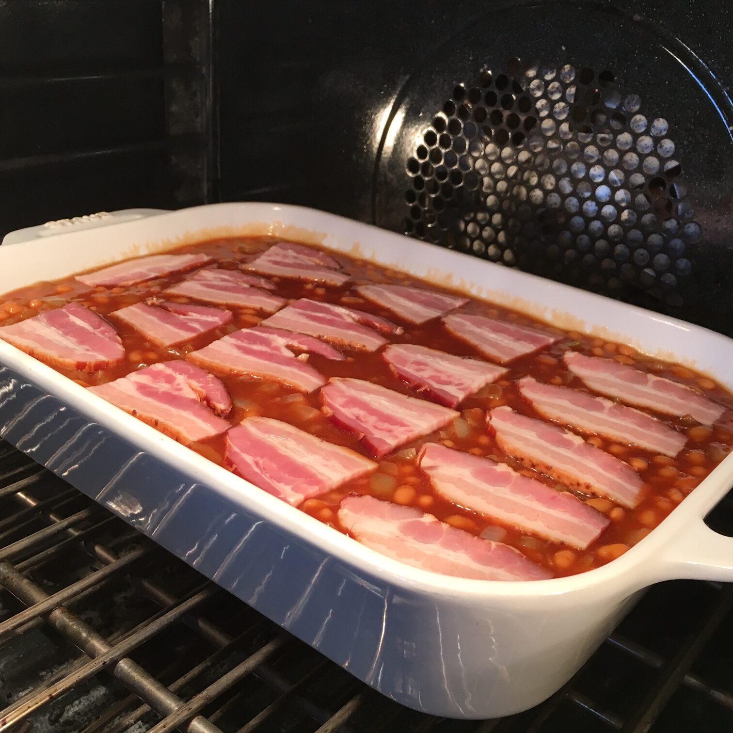 Best Ever Baked Beans placed in the oven, ready to bake.