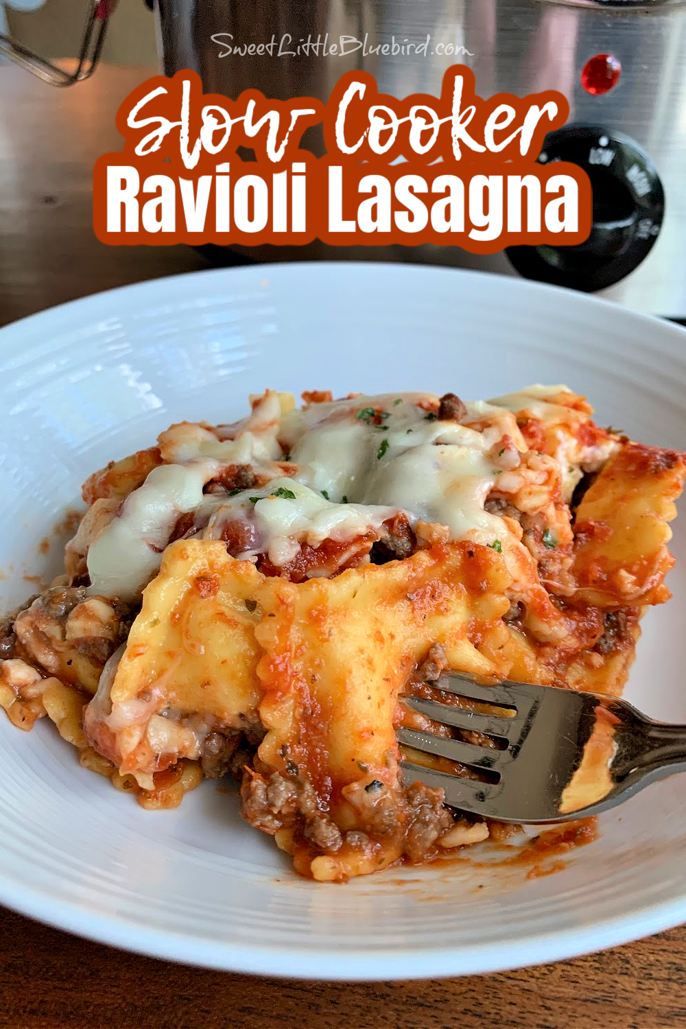 Photo of Slow Cooker Ravioli Lasagna served in a white bowl. 