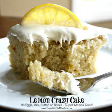 This is a photo showing a piece of Lemon Crazy Cake on a white plate with a fork filled with a bite of the cake, ready to eat.