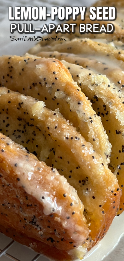 This image shows a close-up of lemon-poppy seed pull-apart bread on a cooling rack.