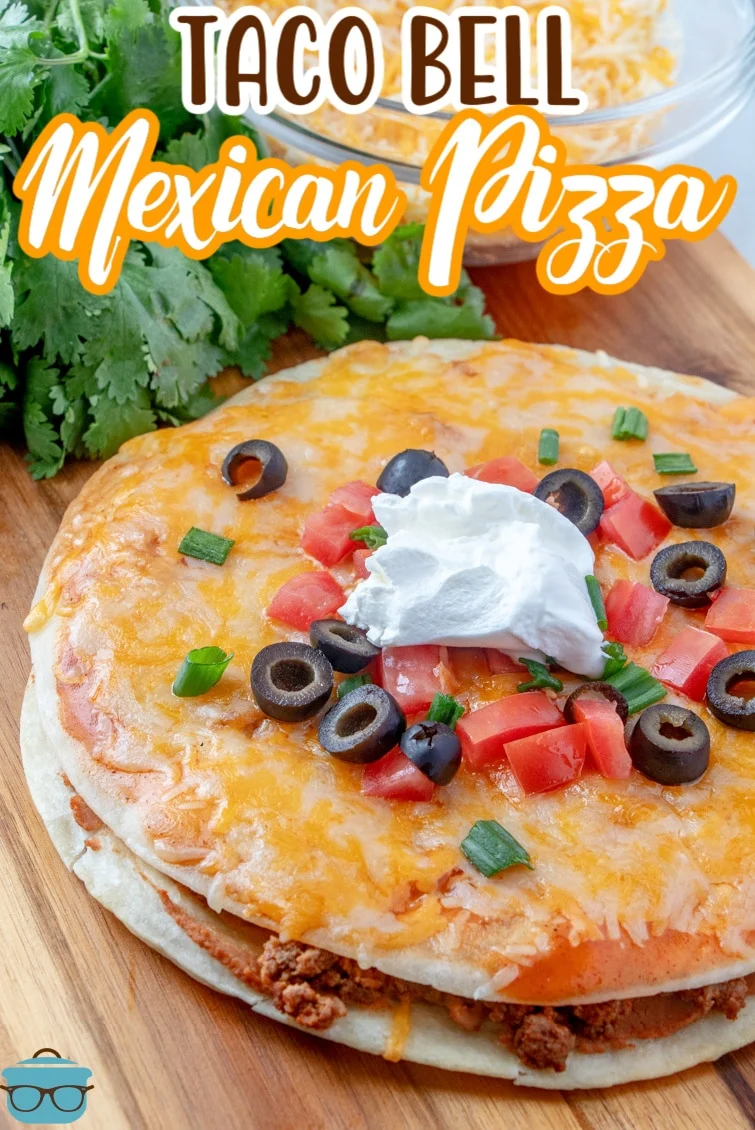 This image shows a Mexican Pizza on a cutting board, ready to eat. 