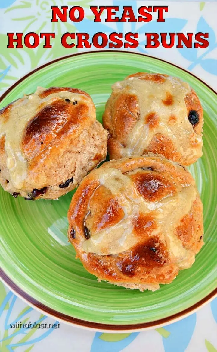 This image shows 3 Hot Cross Buns on a green plate.