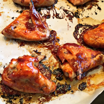 Oven Baked Chicken Wings after baking on baking sheet with parchment paper.