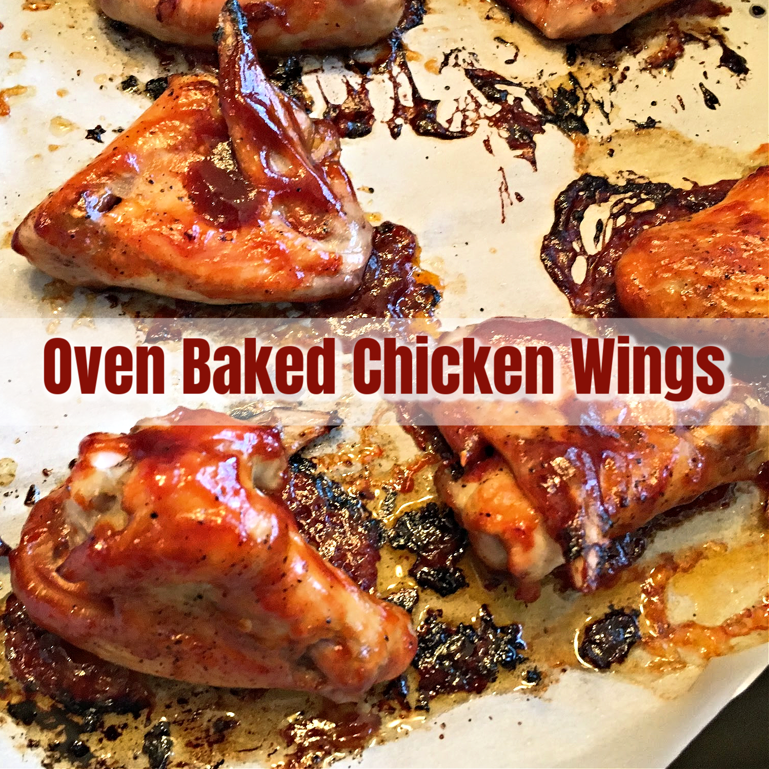 This photo shows oven baked chicken wings on a baking sheet. 