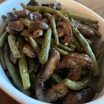 Easy Oven Roasted Green Beans and Mushroom served in a white bowl.