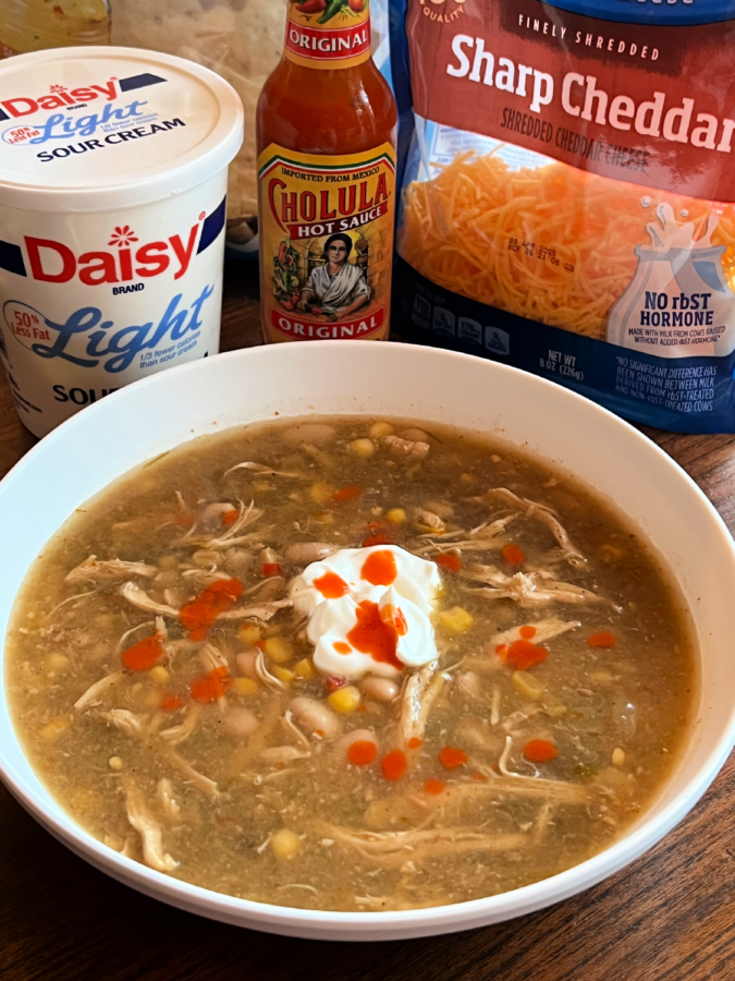 This image shows Slow Cooker Salsa Verde Chicken Soup in a white bowl.