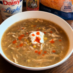 Slow Cooker Salsa Verde Chicken Soup served in a white bowl.