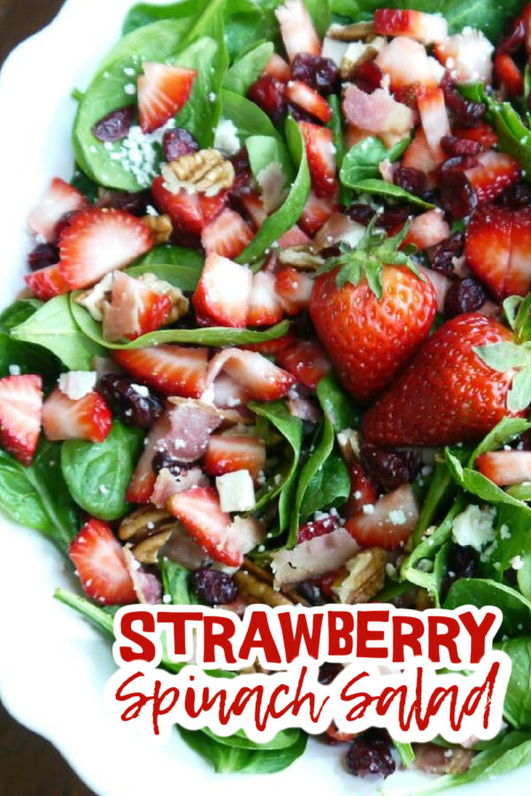 Photo of Strawberry Spinach Salad in a white serving bowl.