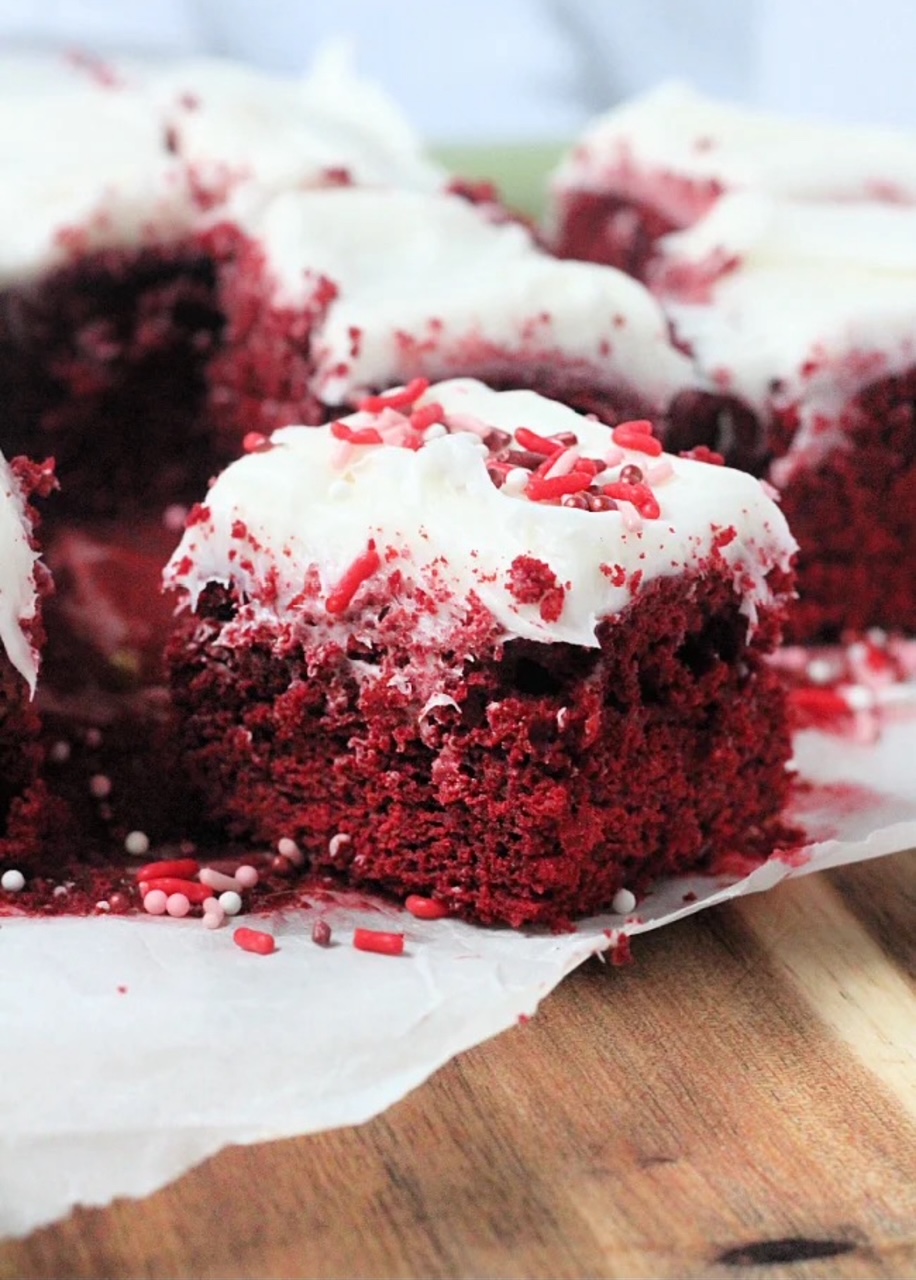 Cake Mix Brownies Cake Mix Brownies on white parchment paper covering a cutting board.