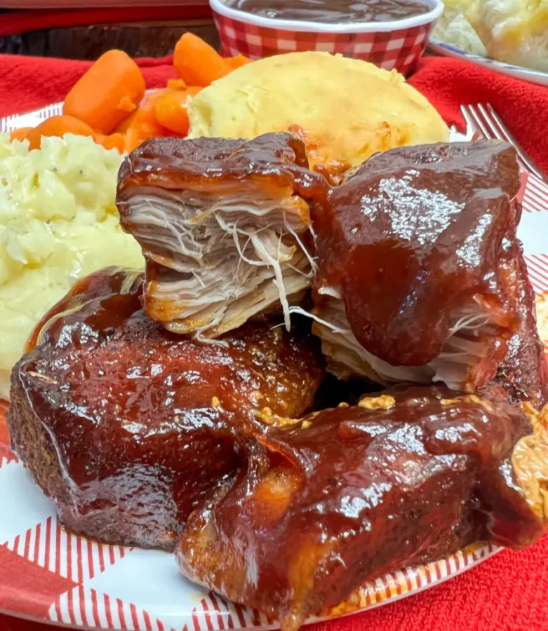 Oven Baked Country Style Ribs on a plate with potato salad, carrots and a roll, recipe and photo  by Back to My Southern Roots