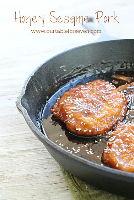 Photo with a cast iron pan with cooked Honey Sesame Pork. 