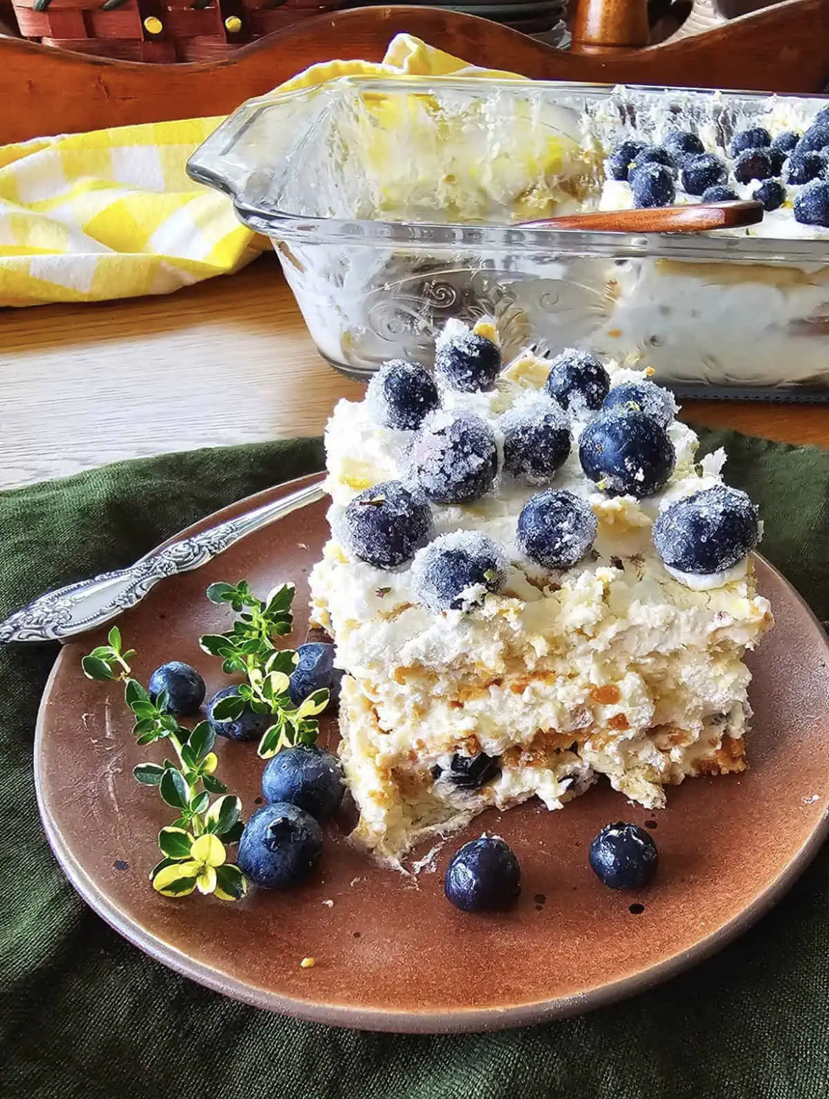 This image shows a piece of Lemon Blueberry Icebox Cake on a plate. 