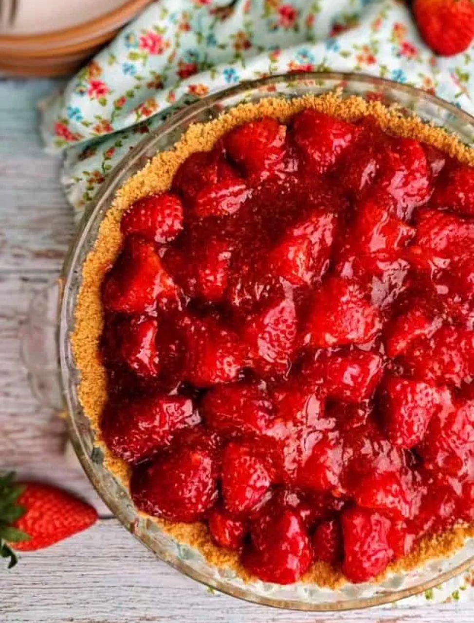 Strawberry Pie in a clear glass  pie plate, ready to serve. 