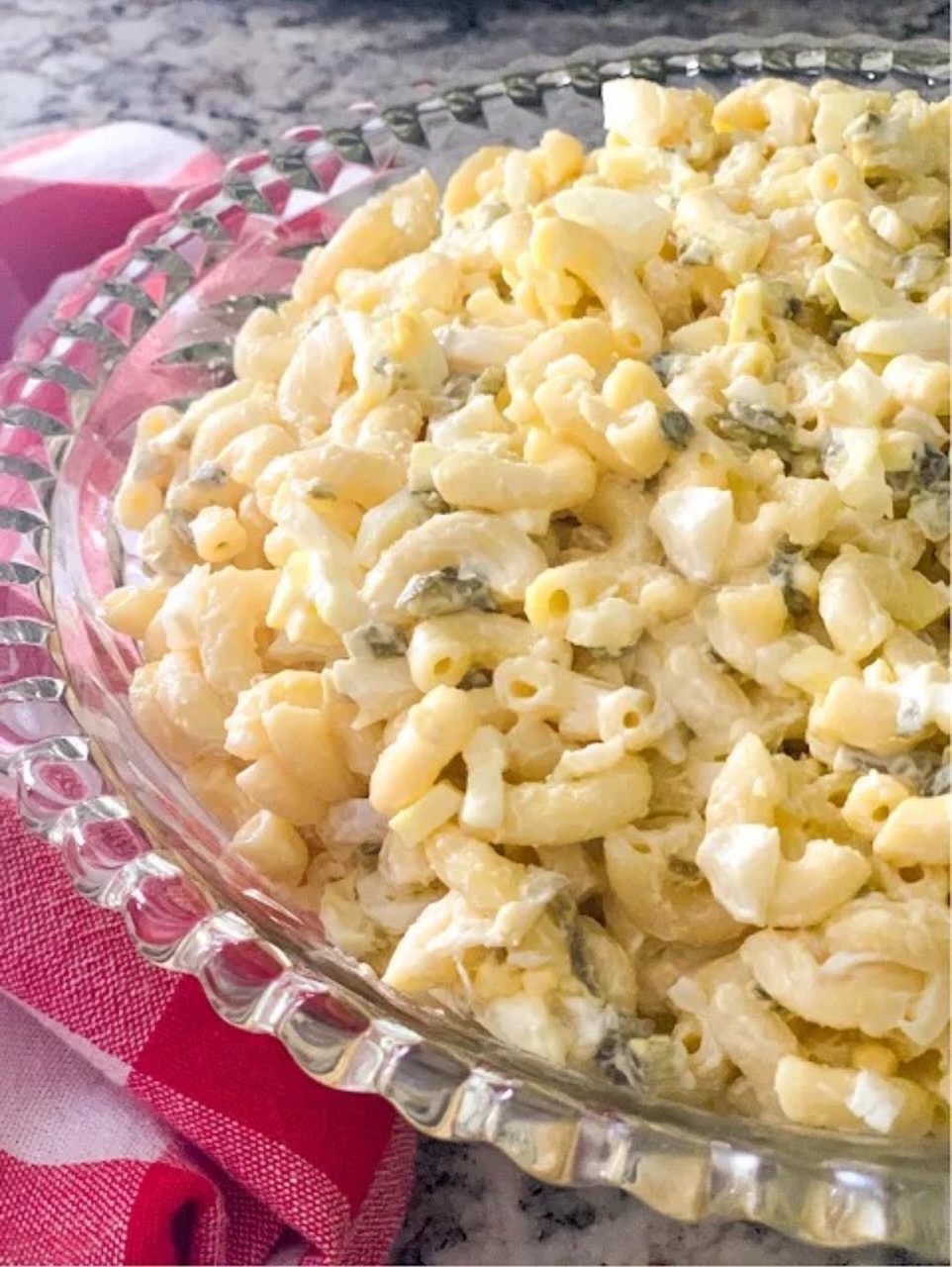My Famous Macaroni Salad Macaroni Salad served in a clear glass serving bowl.