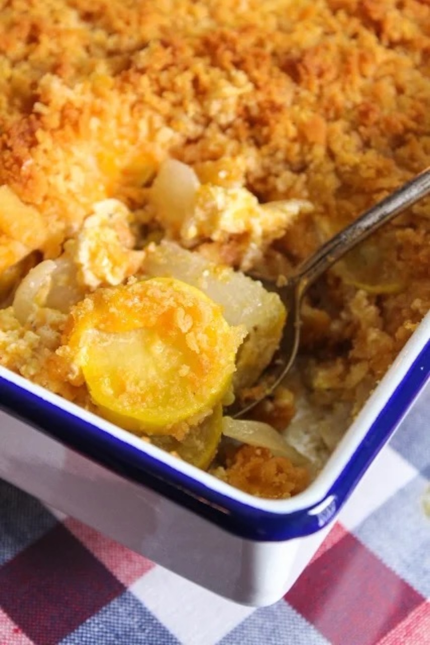 Squash Casserole baked in a blue and white baking dish. 