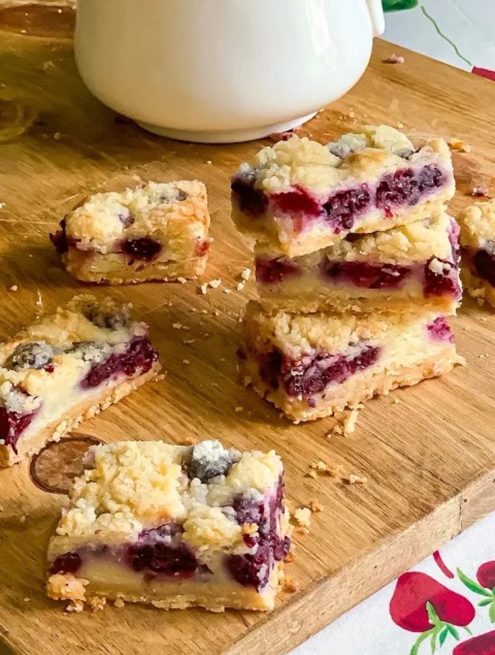 Blackberry Pie bars on a cutting board. 