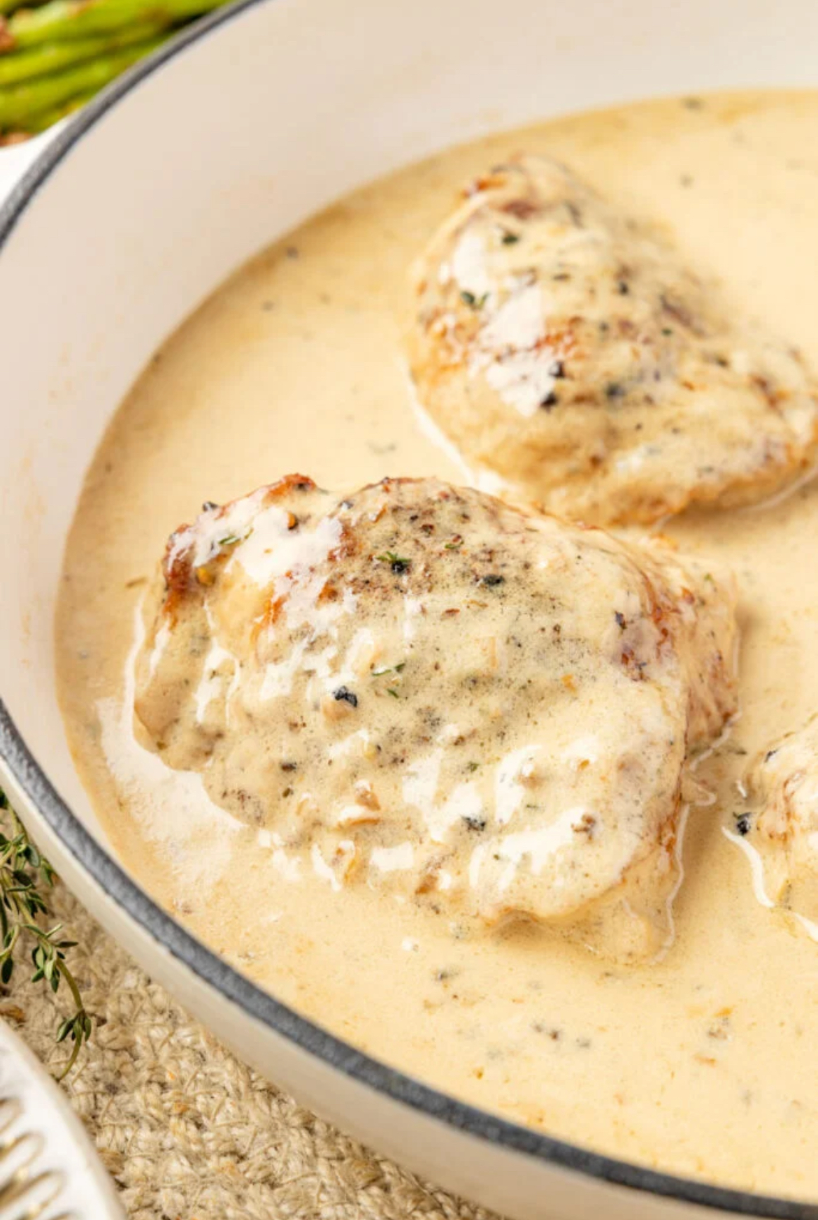 Chicken Au Poivre Chicken Au Poivre cooked in an off white Dutch oven. Ready to serve.