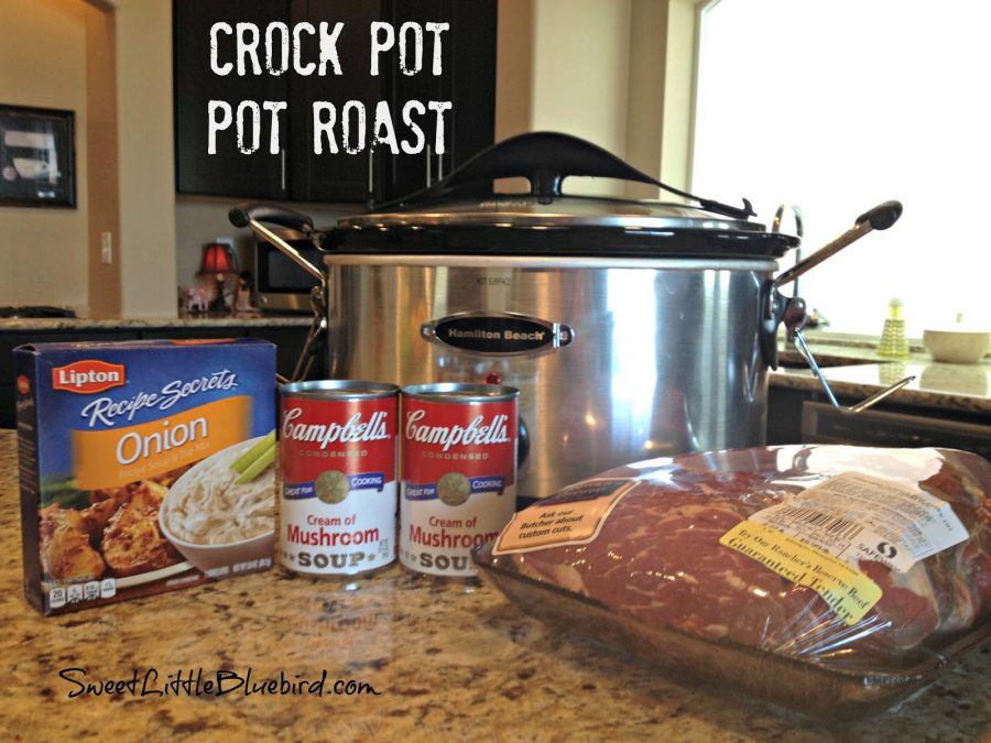 This is a photo showing the ingredients to make Crock Pot Pot Raost (onion soup mix, cream of mushroom soup and a roast) on a counter top with a slow cooker behind them. 