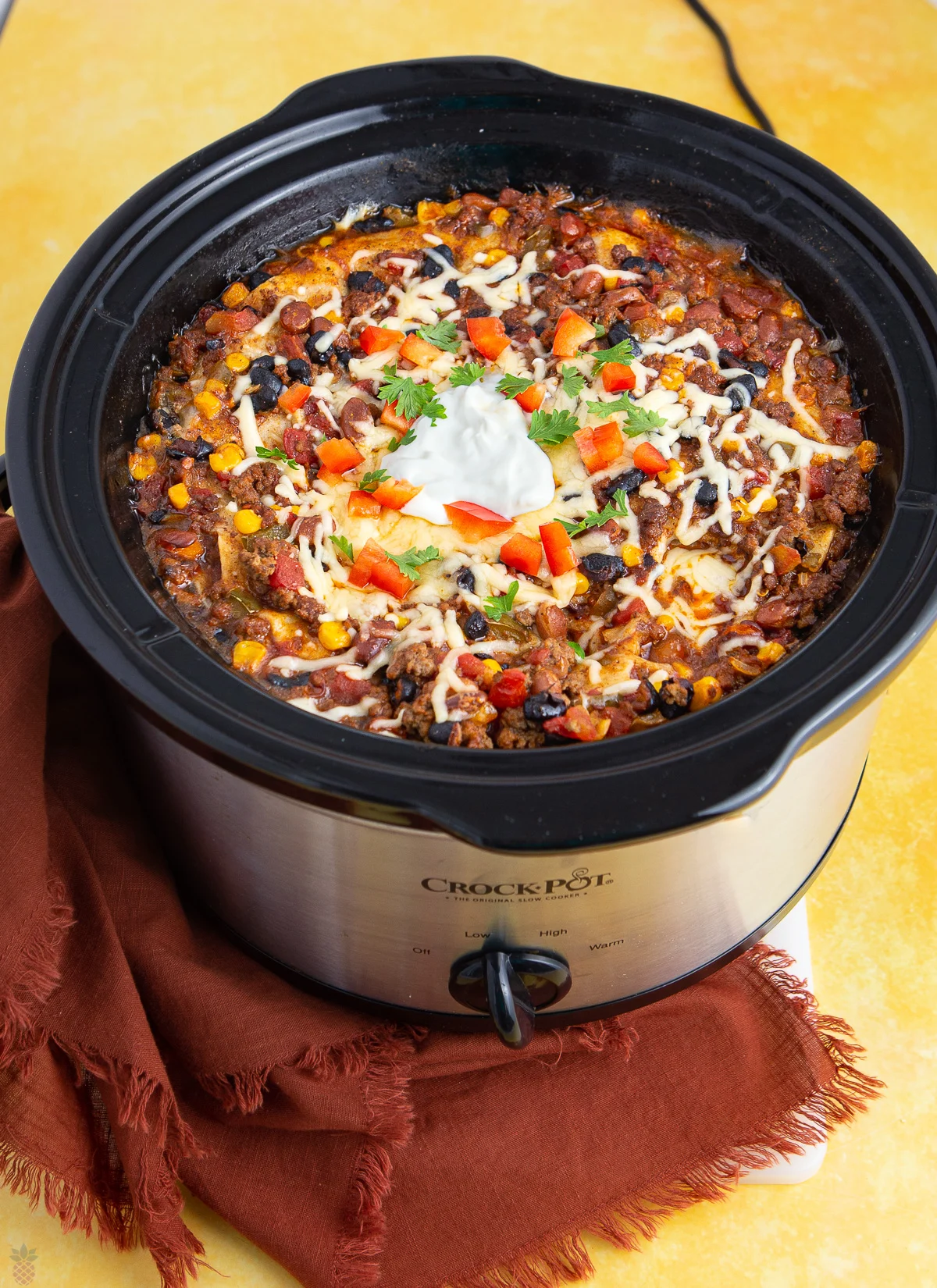 This photo shows Mexican Casserole in a Crock Pot after cooking, ready to serve. 