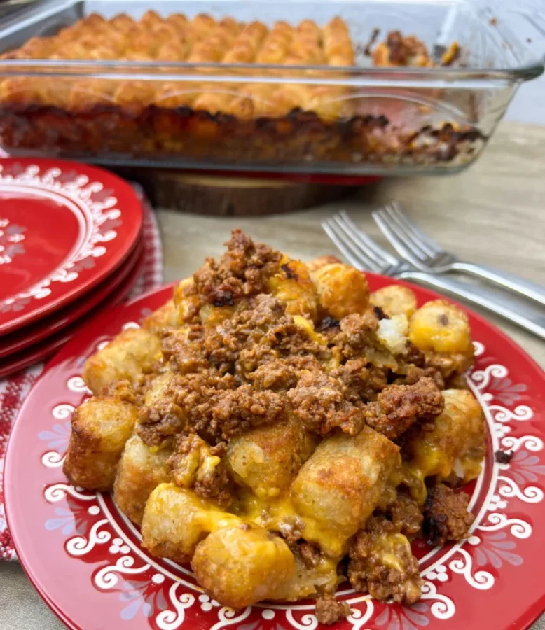 Photo of Easy Sloppy Joe Tater Tot Casserole served on a Red Plate.