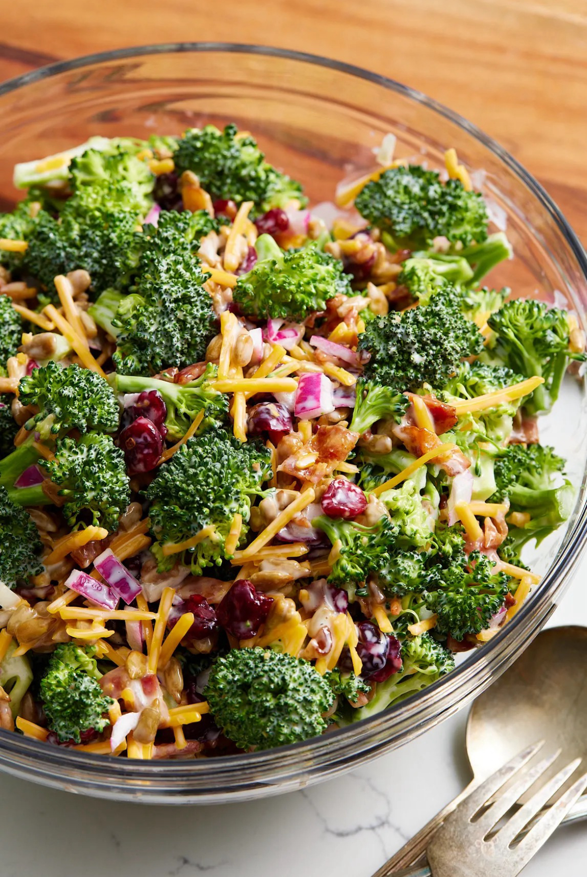 Broccoli Salad Broccoli Salad in a clear glass serving bowl.